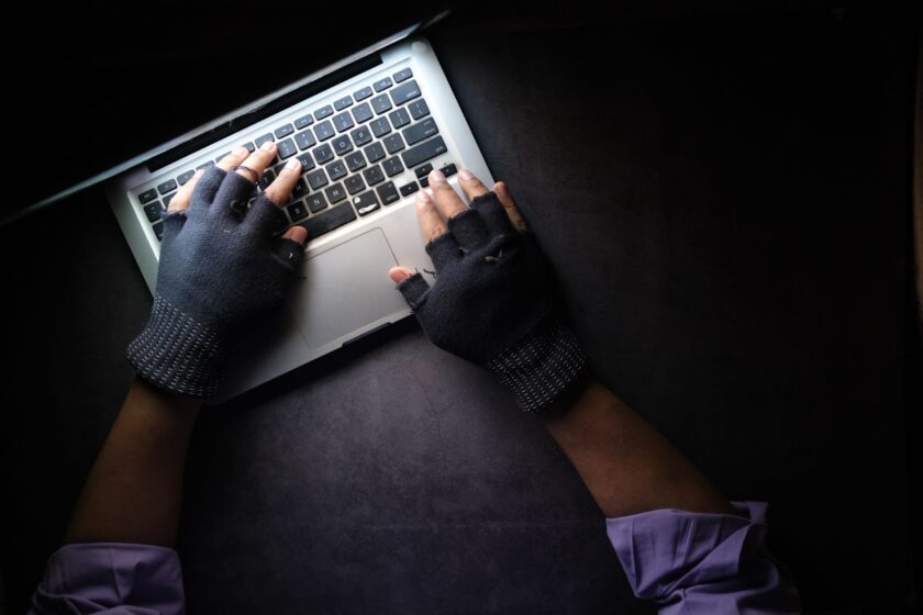 https://www.pexels.com/photo/a-person-typing-on-laptop-while-wearing-a-fingerless-gloves-8541751/